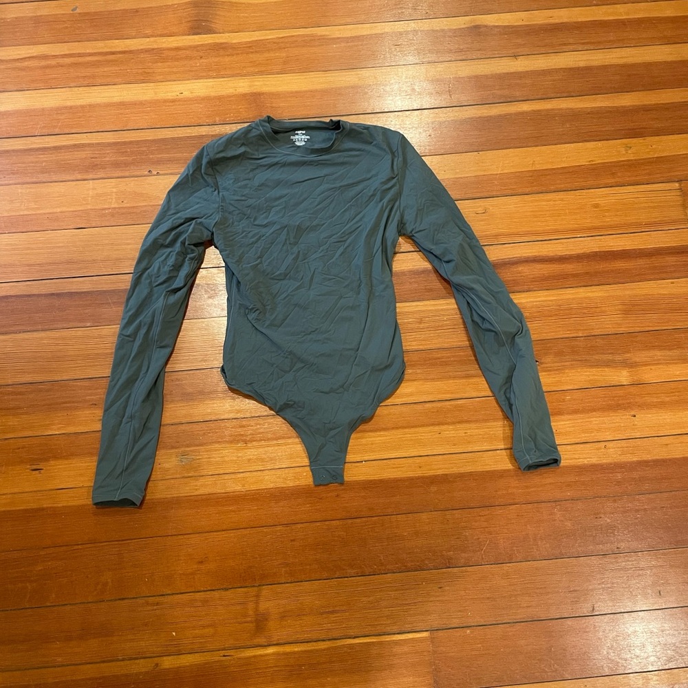 Skims grey/green colored bodysuit. Size medium.